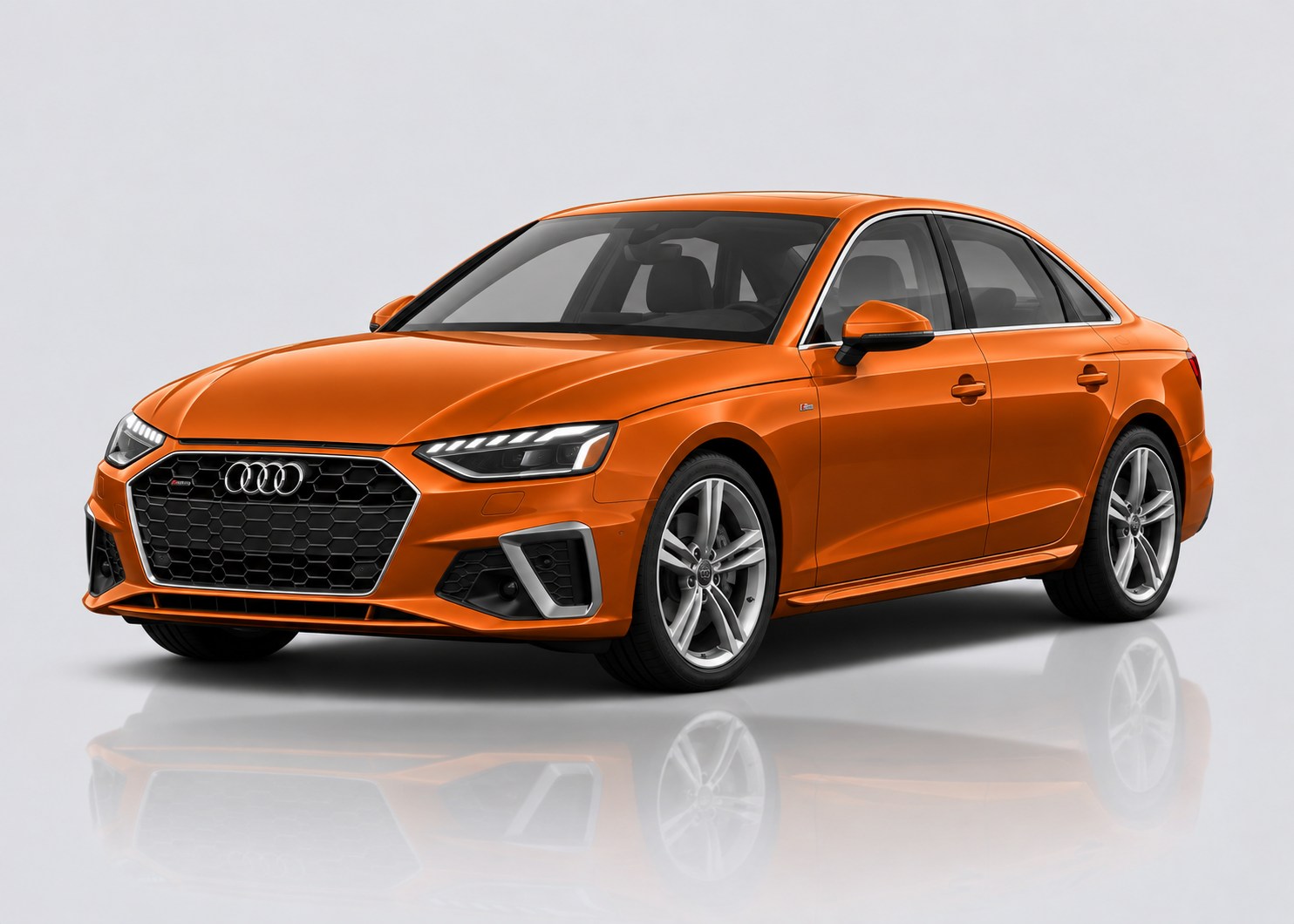 Orange Audi A4 in a light grey studio