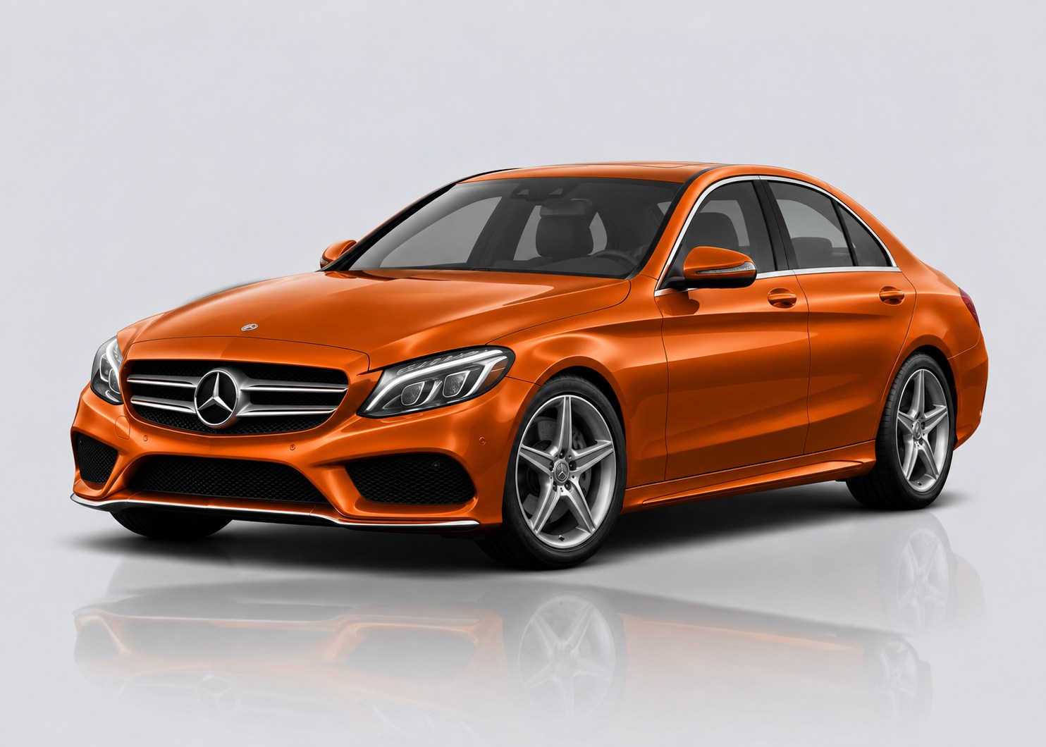Orange Mercedes C-Class in a light grey studio