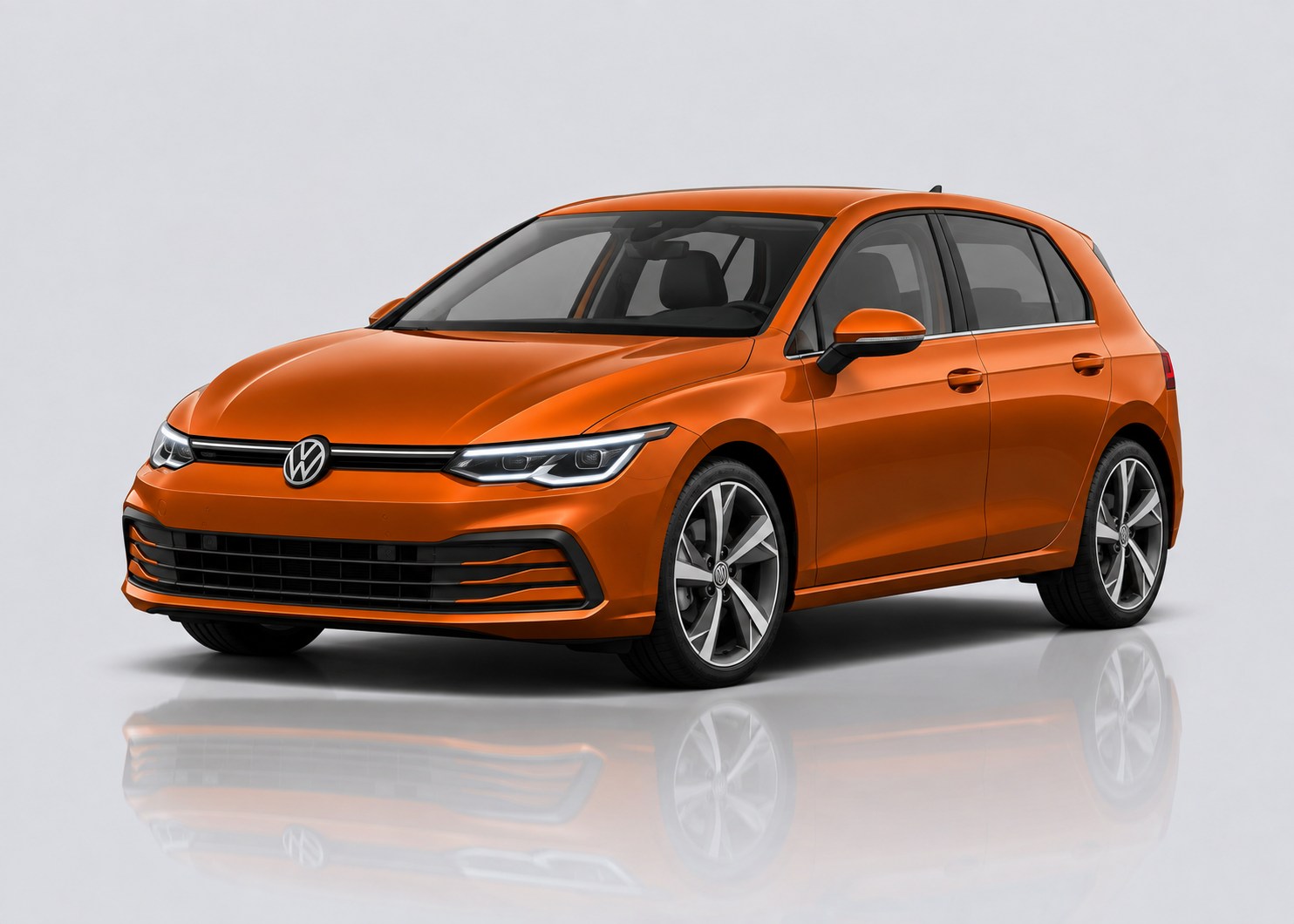 Orange Volkswagen Golf in a light grey studio